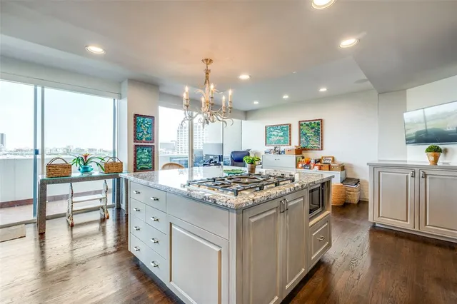a kitchen with stainless steel appliances granite countertop counter space a sink and white cabinets