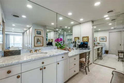 a kitchen with sink stove and cabinets
