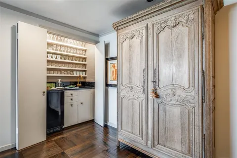 a view of kitchen with granite countertop window and refrigerator