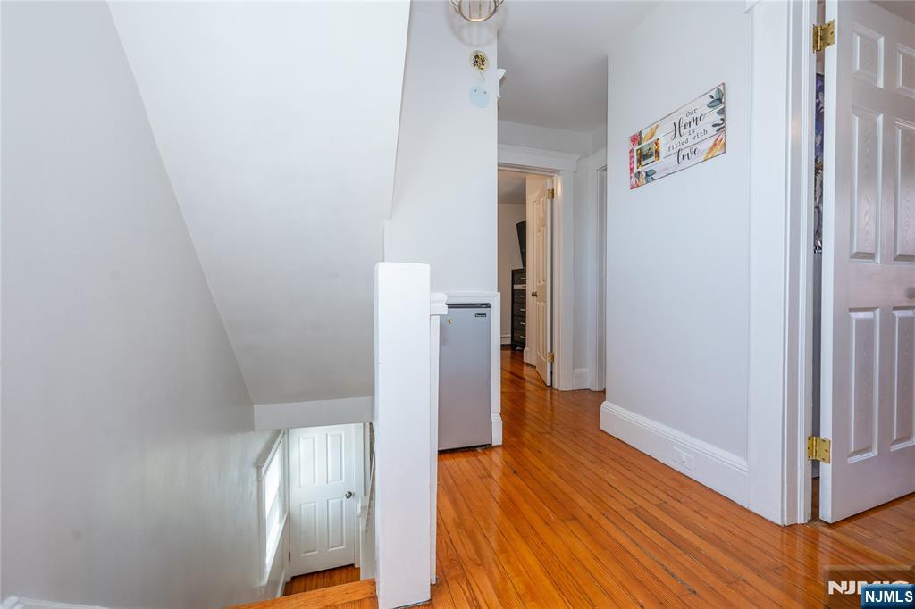 690 Garden Street Maywood, NJ 07607 - Photo 29 of 49 a view of a hallway with wooden floor and closet