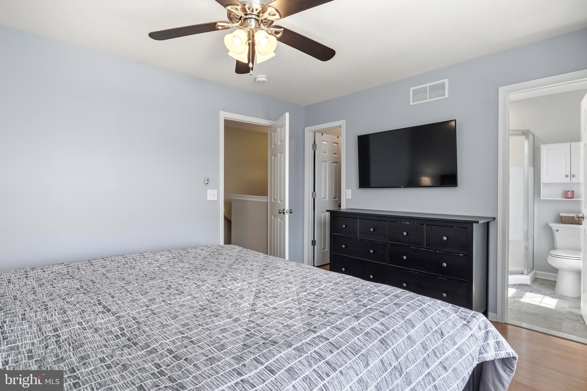 129 Catherine Street, Unit 3 Telford, PA 18969 - Photo 18 of 34 a bedroom with a bed and a flat screen tv