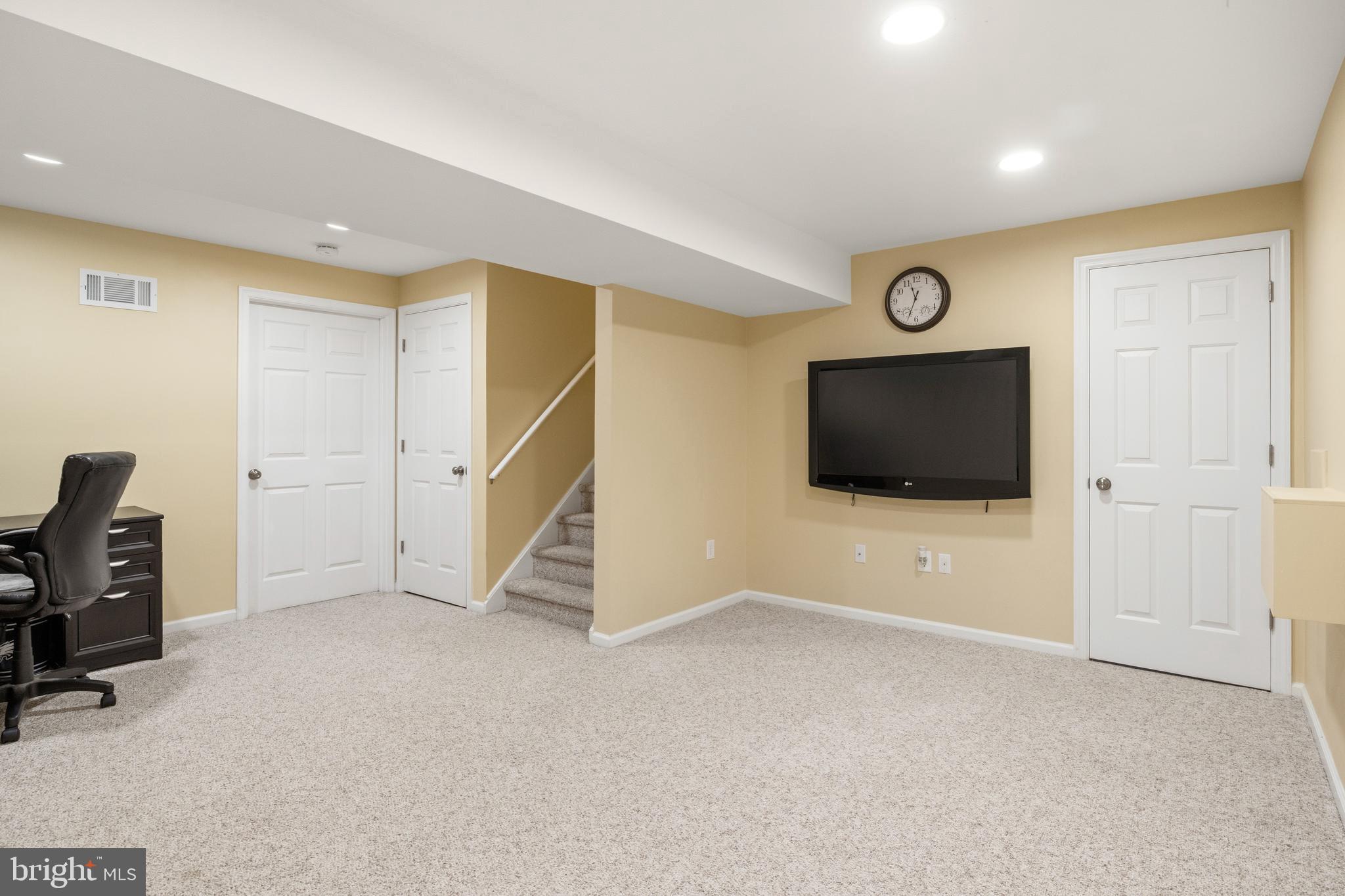 129 Catherine Street, Unit 3 Telford, PA 18969 - Photo 25 of 34 a view of an empty room with a flat screen tv and a window
