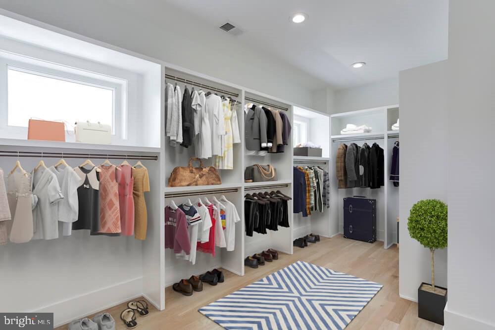 2925 West Ox Road Herndon, VA 20171 - Photo 12 of 38 a walk in closet with clothes and shoes