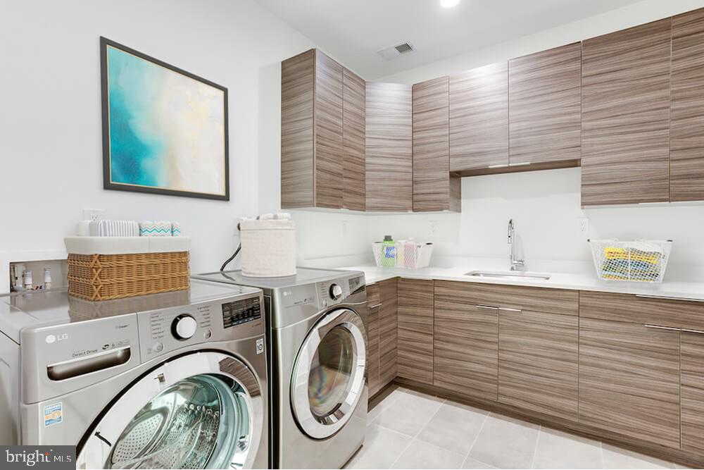 2925 West Ox Road Herndon, VA 20171 - Photo 13 of 38 a view of a kitchen with sink washer and dryer