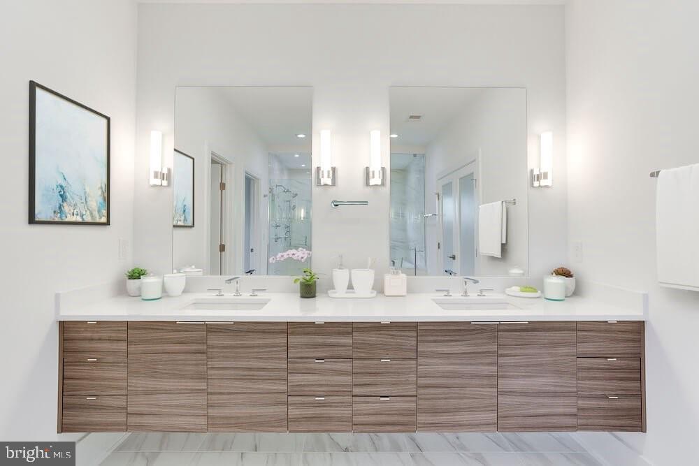 2925 West Ox Road Herndon, VA 20171 - Photo 16 of 38 a bathroom with a sink vanity granite and a mirror
