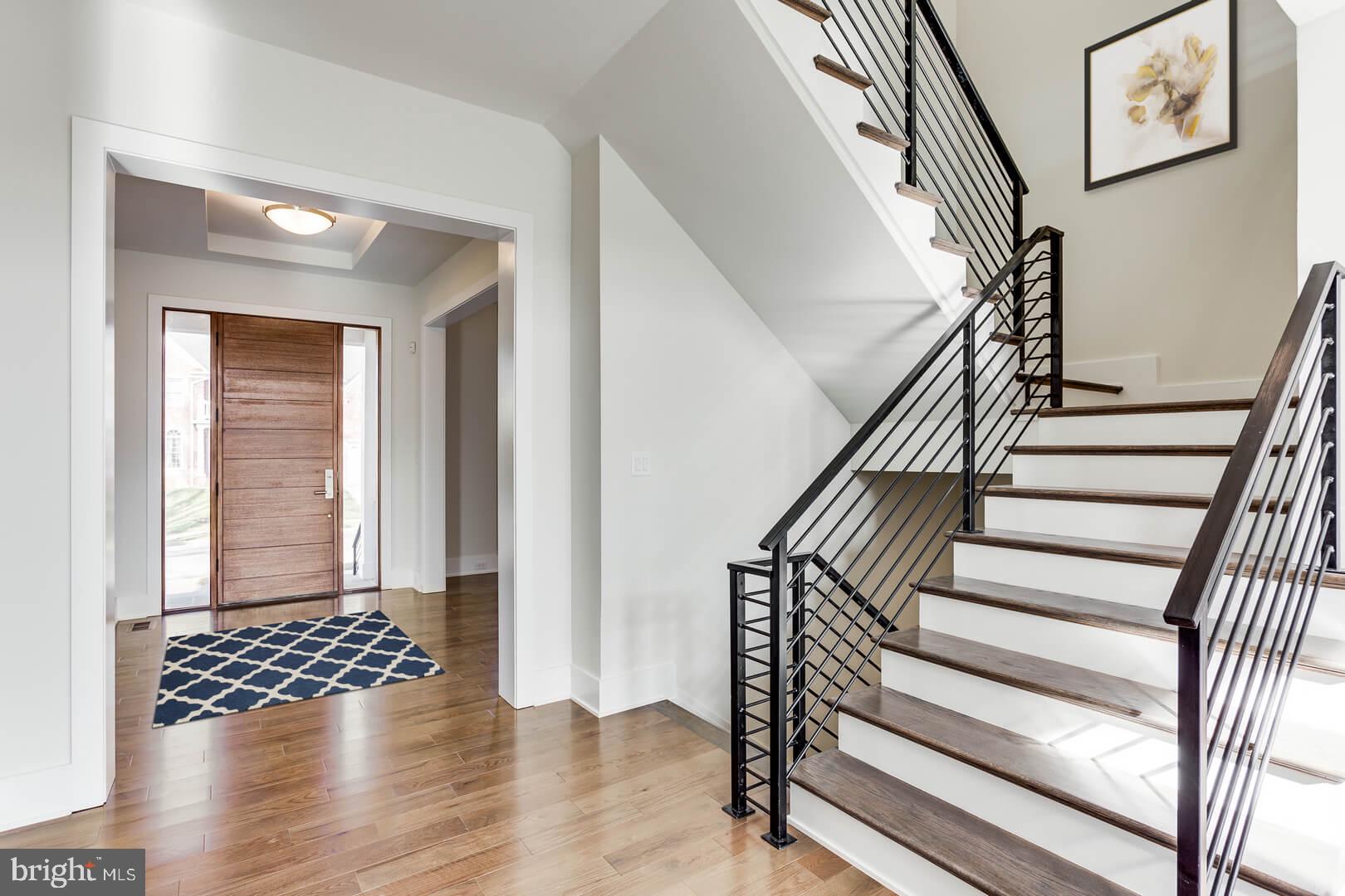 2925 West Ox Road Herndon, VA 20171 - Photo 24 of 38 a view of entryway with wooden floor and stairs