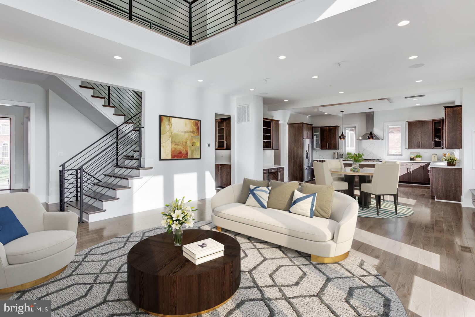2925 West Ox Road Herndon, VA 20171 - Photo 27 of 38 a living room with furniture a dining table and a potted plant