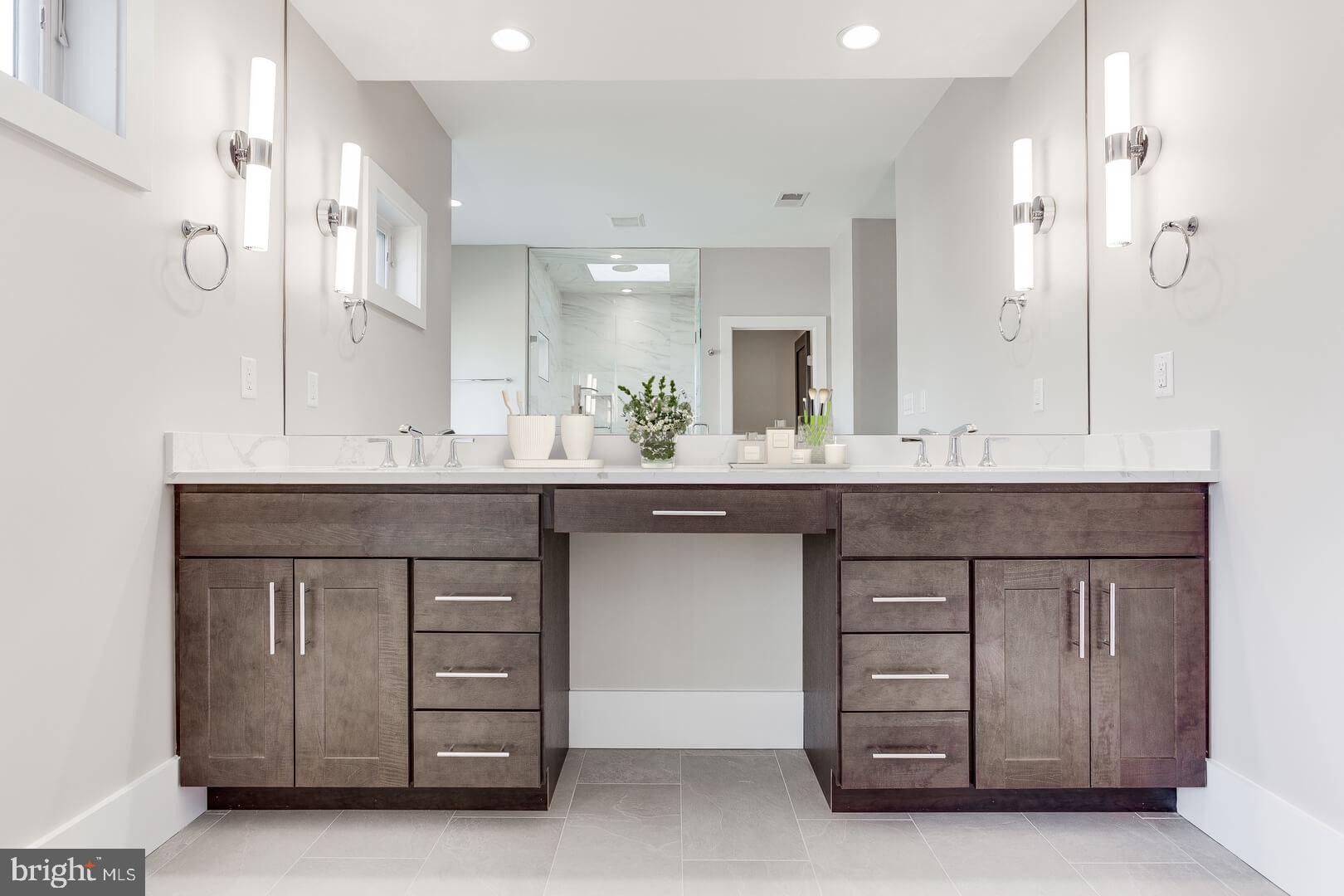 2925 West Ox Road Herndon, VA 20171 - Photo 35 of 38 a bathroom with a sink double vanity and a mirror