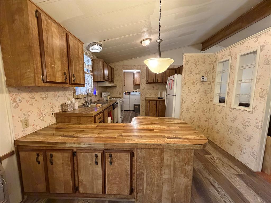 804 Preston Road Red Oak, TX 75154 - Photo 15 of 36 Wood-finish cabinetry paired with a matching wood-finish countertop
