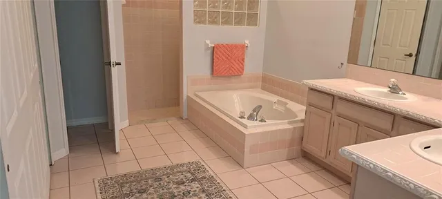a bathroom with a sink a toilet and bathtub