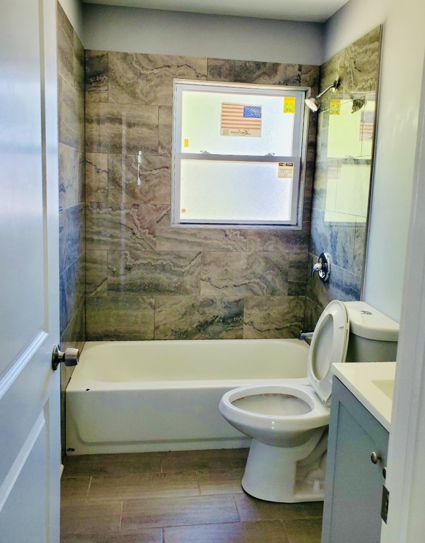 2820 12th Avenue Broadview, IL 60155 - Photo 6 of 7 a bathroom with a toilet and a bathtub
