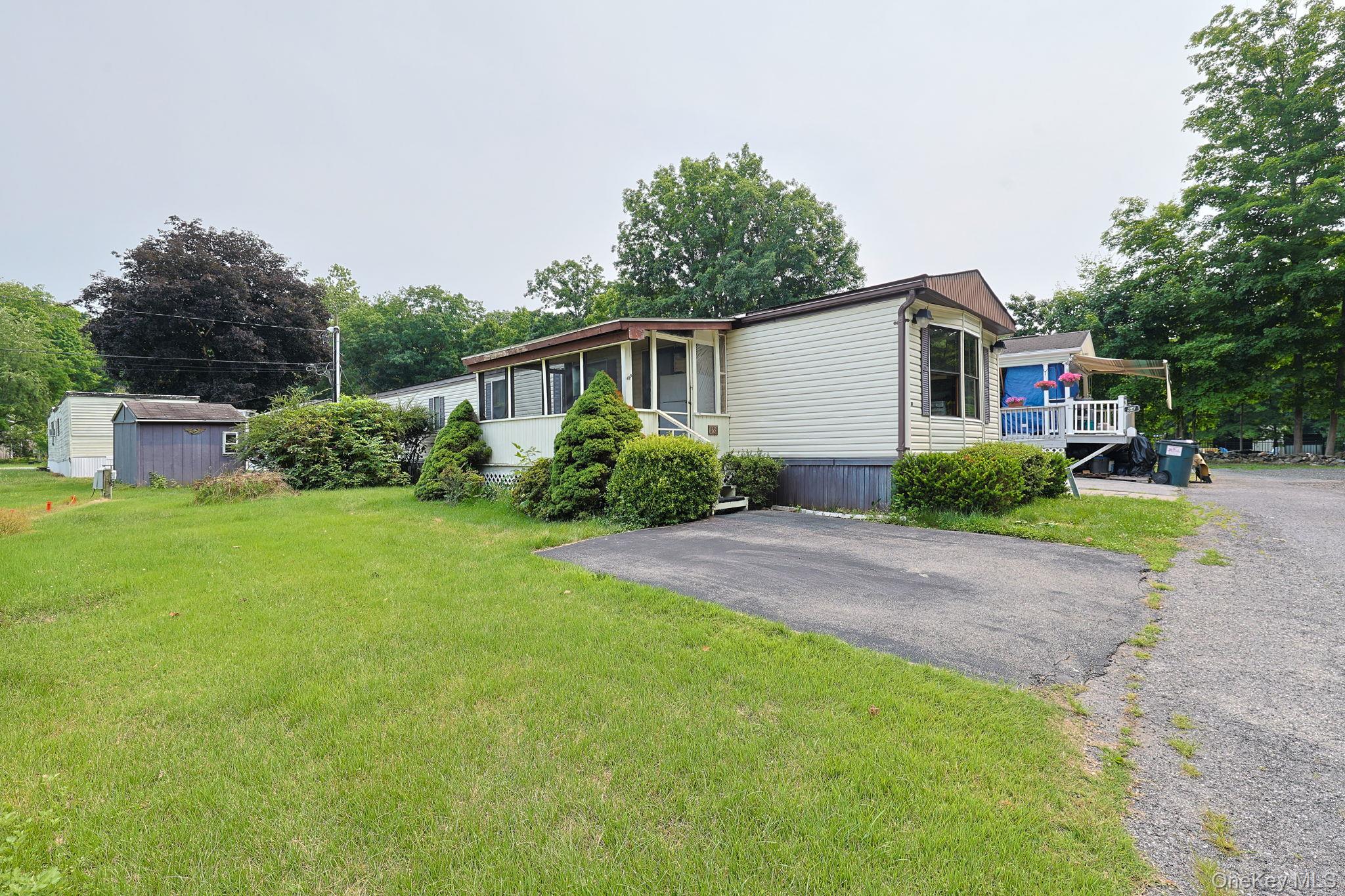 63 Tanglewood Road Hopewell Junction, NY 12533 - Photo 12 of 20 a front view of a house with garden