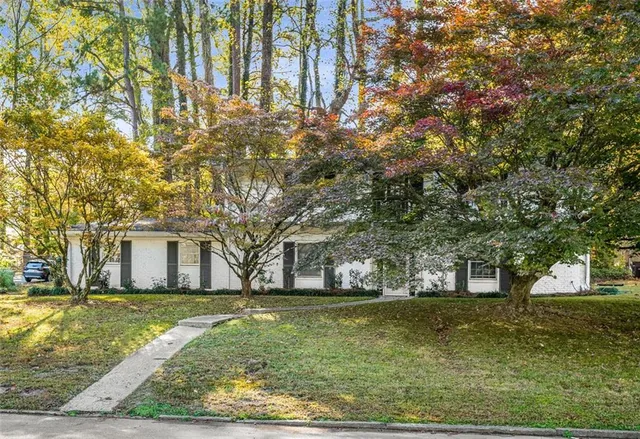 a view of house with yard