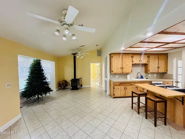 a view of a kitchen with furniture and chandelier