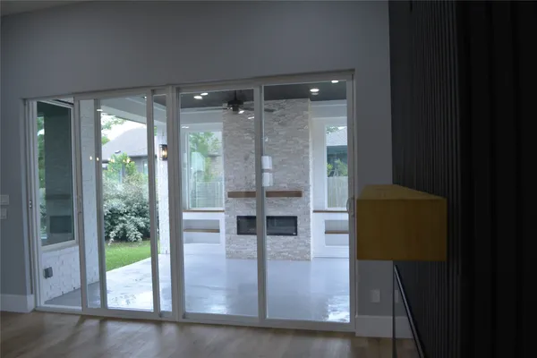 a view of entryway with wooden floor and garden