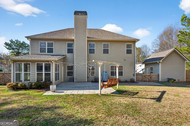 a view of a house with a yard and plants