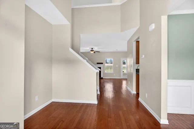 a view of a hallway view with wooden floor