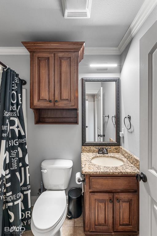 2220 Forest Hills Boulevard Haughton, LA 71037 - Photo 39 of 40 Bathroom featuring a dark wood-finish vanity with a granite-style countertop and an undermount sink