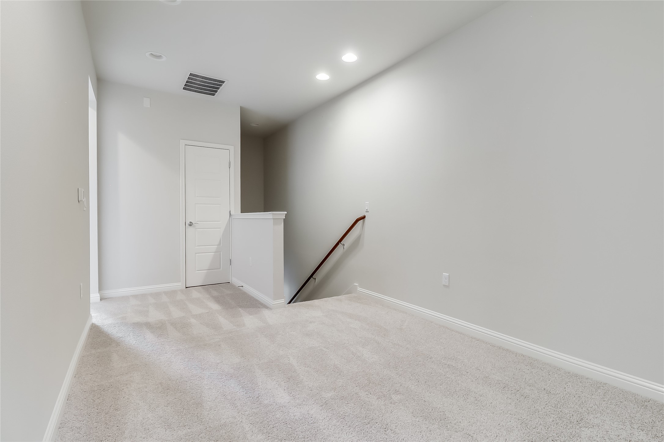 6814 East Riverside Drive, Unit 32 Austin, TX 78741 - Photo 10 of 26 Upstairs you will find a bonus living area that separated the primary suite from the secondary bedroom hallway.