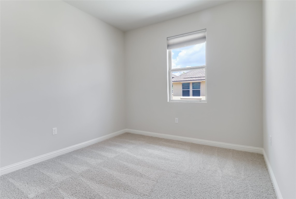 6814 East Riverside Drive, Unit 32 Austin, TX 78741 - Photo 17 of 27 an empty room with a window
