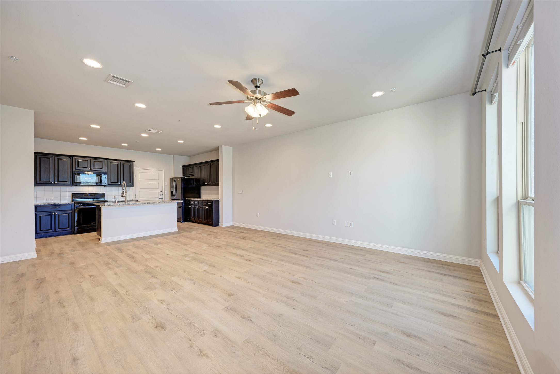 6814 East Riverside Drive, Unit 32 Austin, TX 78741 - Photo 23 of 26 Inside you will find a desirable open floor plan for the living room and kitchen.