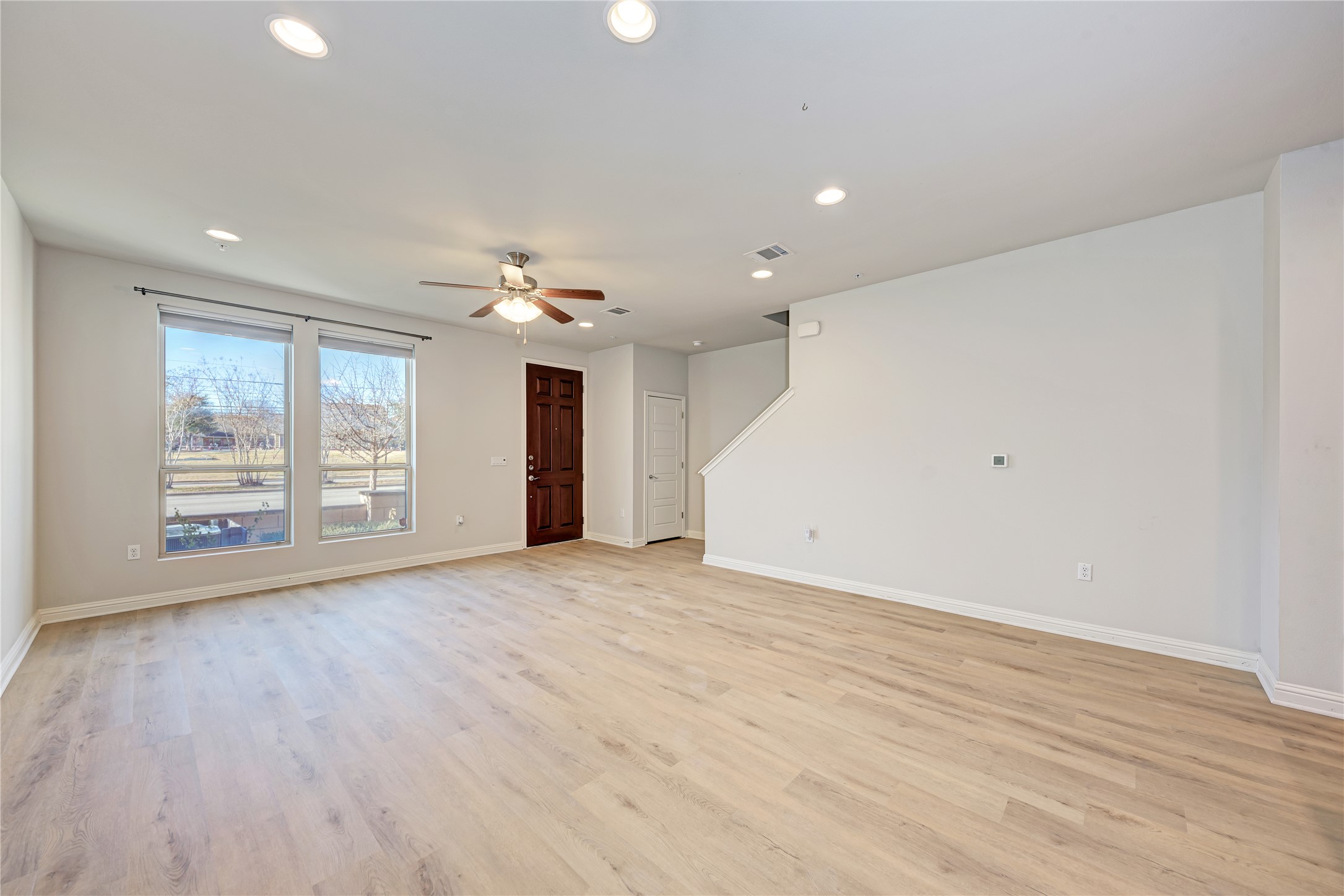6814 East Riverside Drive, Unit 32 Austin, TX 78741 - Photo 5 of 26 Featuring tall ceilings, recessed lighting, refreshing tile flooring, and neutral paint.