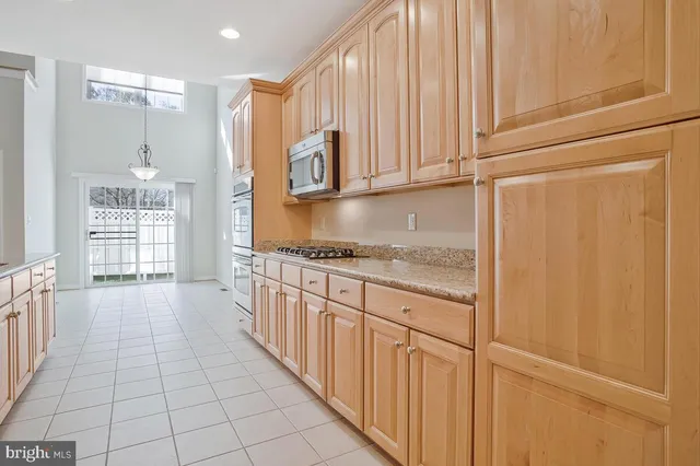 a view of a livingroom with wooden floor and fireplace