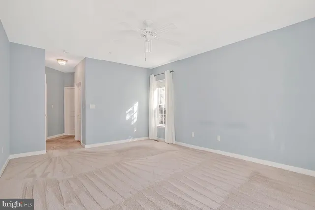 a bathroom with a double vanity sink a mirror and a bathtub