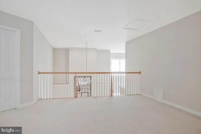 a view of a house with a yard and furniture