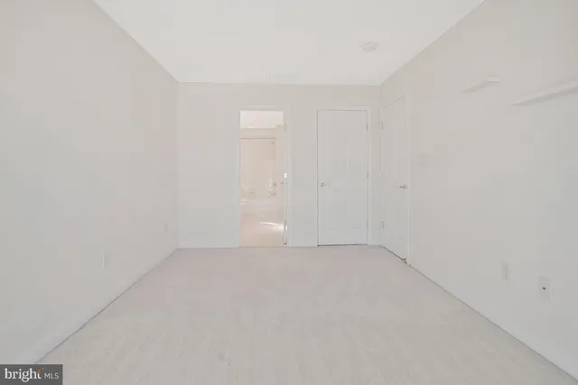 a view of a sign on a wall next to a road