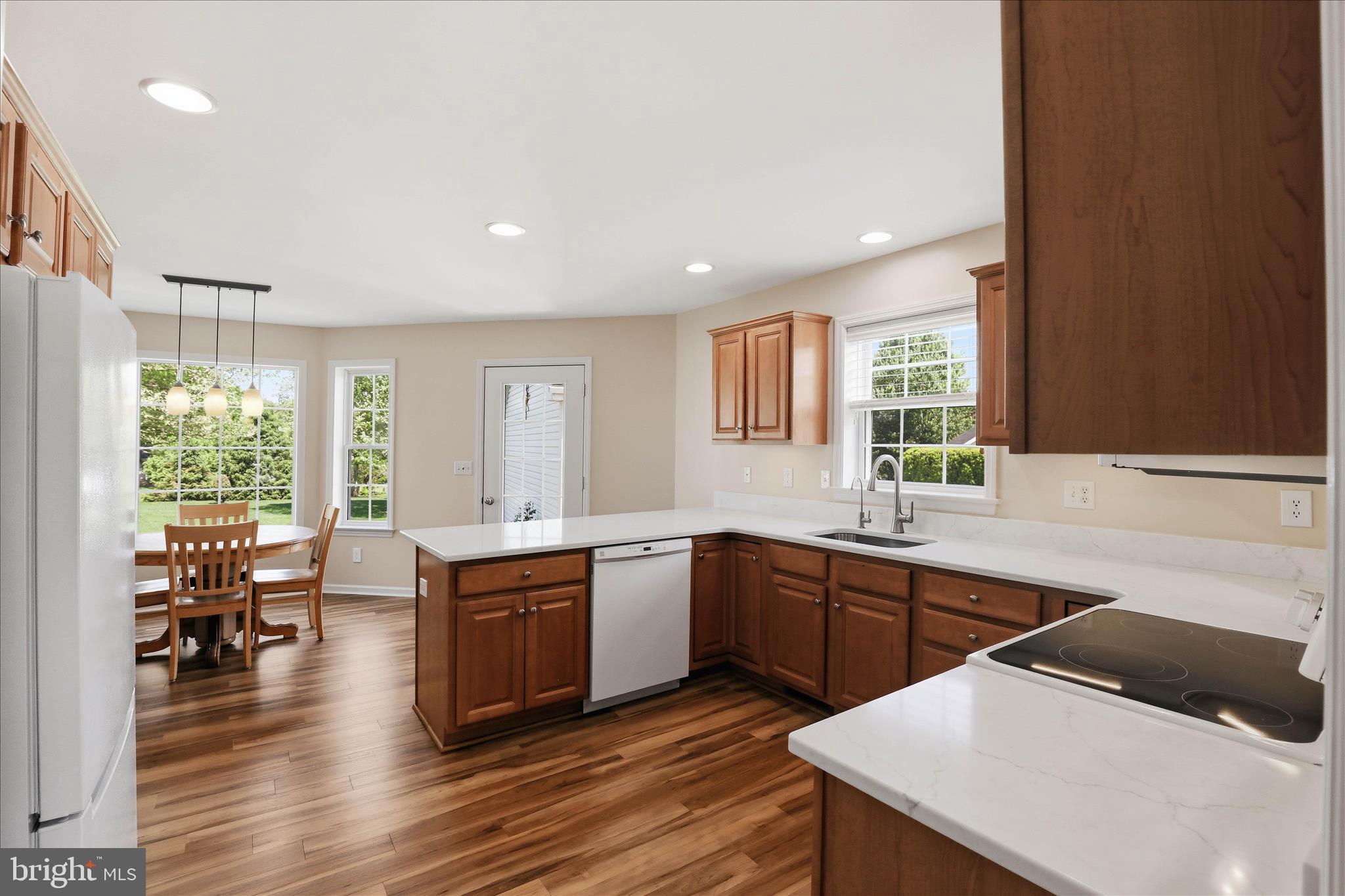 533 Thornberry Lane Lititz, PA 17543 - Photo 15 of 56 a large white kitchen with wooden floor and stainless steel appliances