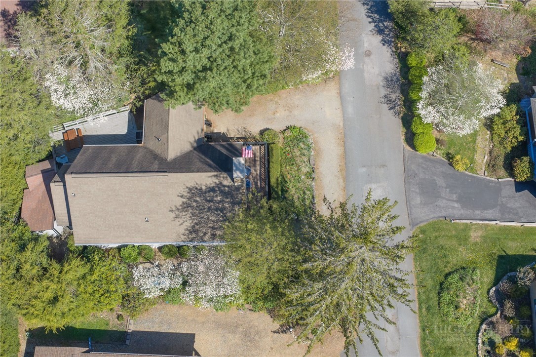 83 Pine Ridge Loop Newland, NC 28657 - Photo 20 of 32 an aerial view of a house with a yard basket ball court and outdoor seating