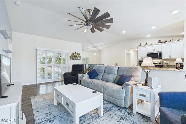 a living room with furniture and a large window