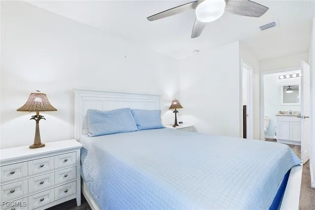 a bedroom with a bed and a dresser