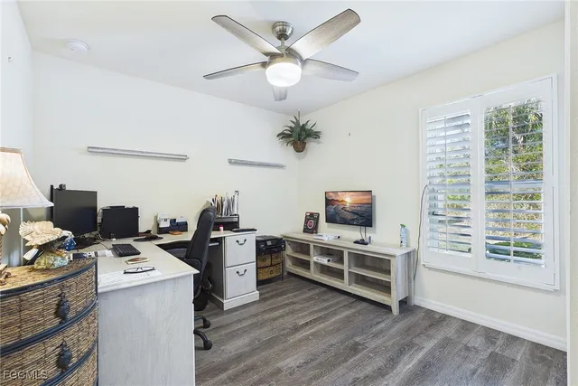a view of workspace with furniture and a flat screen tv