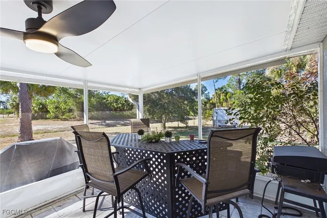a view of a patio with a dining table and chairs