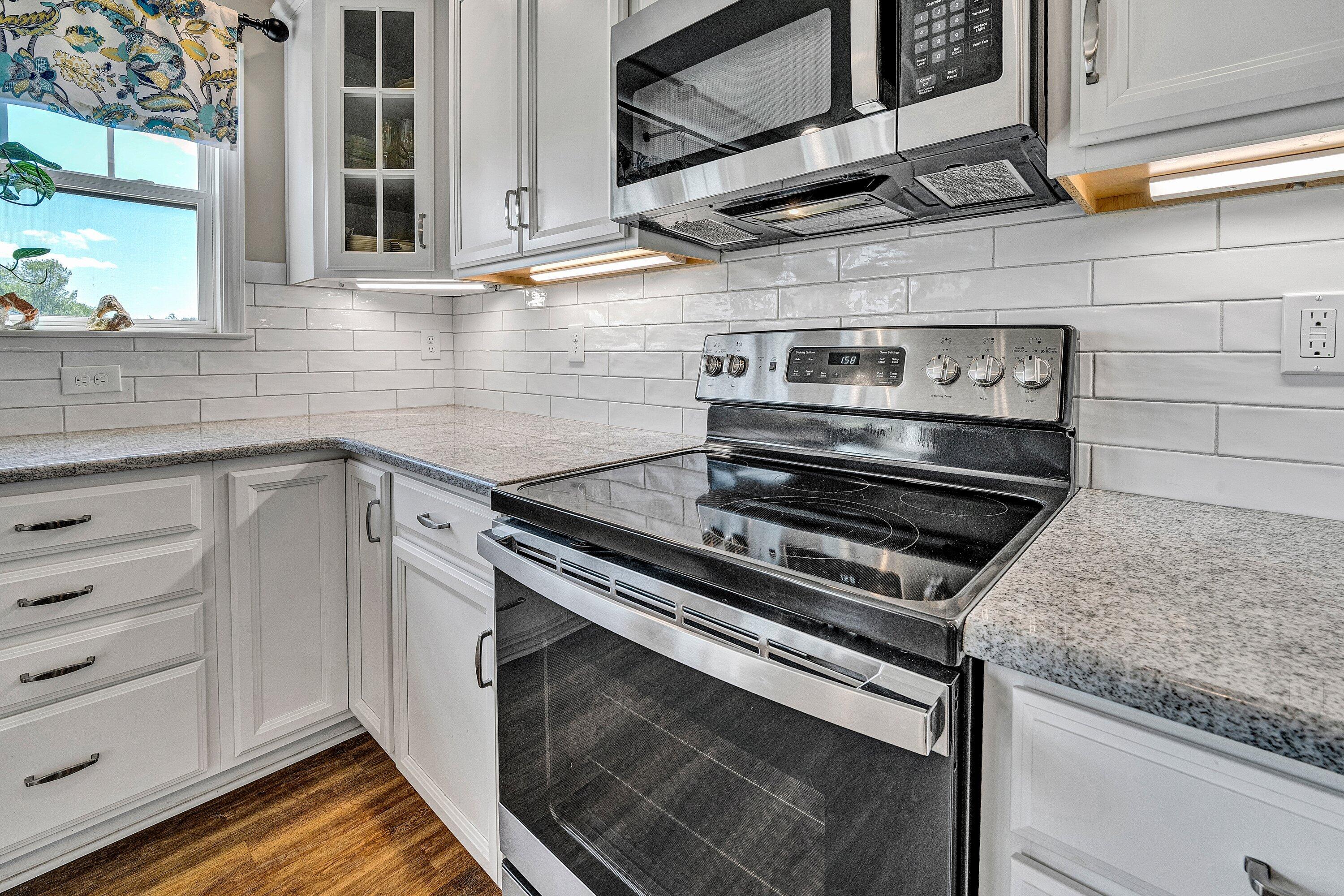 915 Morewood Road Hardy, VA 24101 - Photo 13 of 58 a kitchen with a stove and a sink