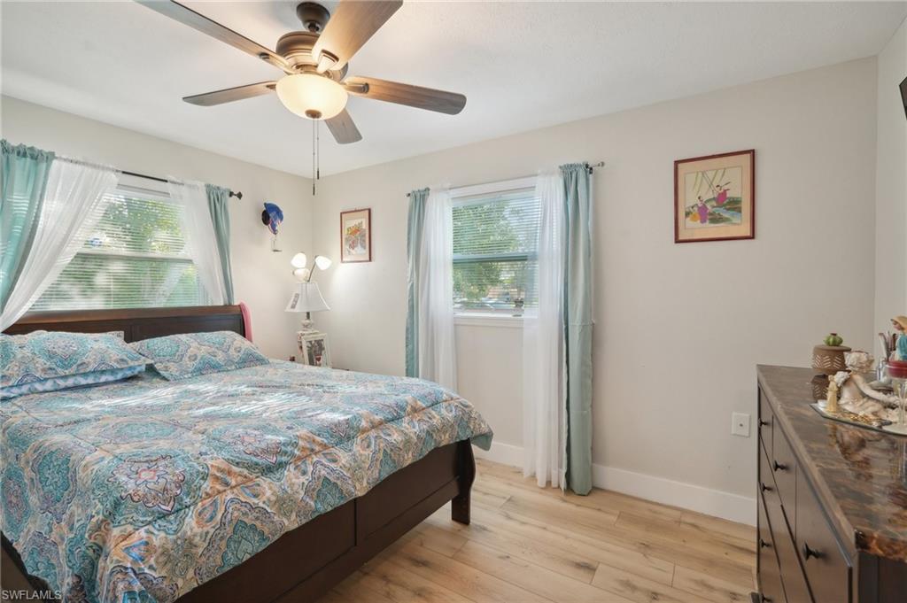 501 Penn Road West Lehigh Acres, FL 33936 - Photo 21 of 27 a bedroom with a bed dresser and a window