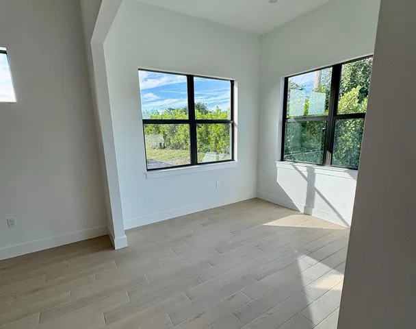 an empty room with windows