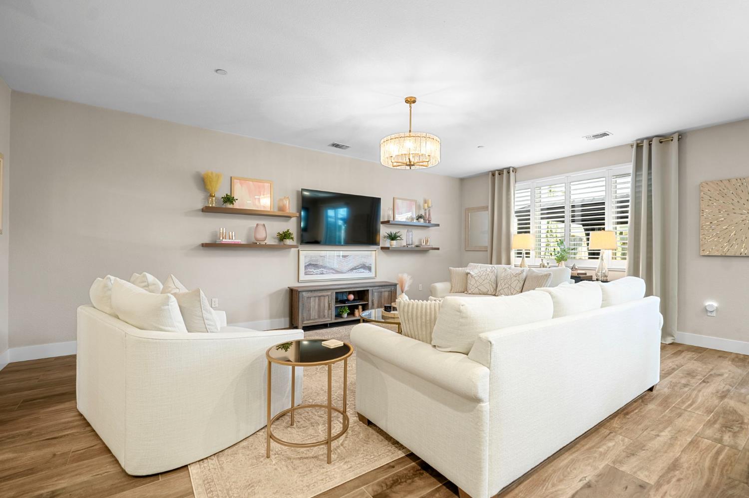 1642 Mcmanis Lane Ripon, CA 95366 - Photo 13 of 44 a living room with furniture and a wooden floor