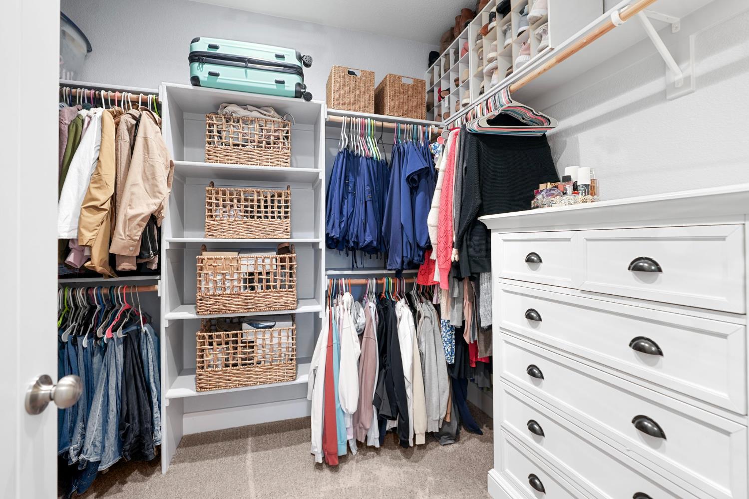 1642 Mcmanis Lane Ripon, CA 95366 - Photo 32 of 44 a view of walk in closet with clothes and shoes