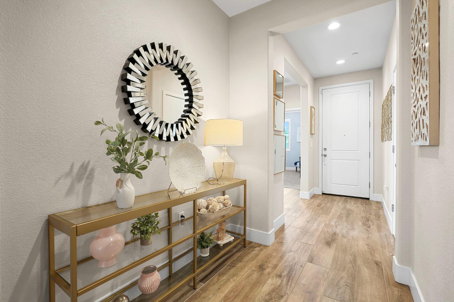 1642 Mcmanis Lane Ripon, CA 95366 - Photo 6 of 44 a view of a hallway with wooden floor and staircase