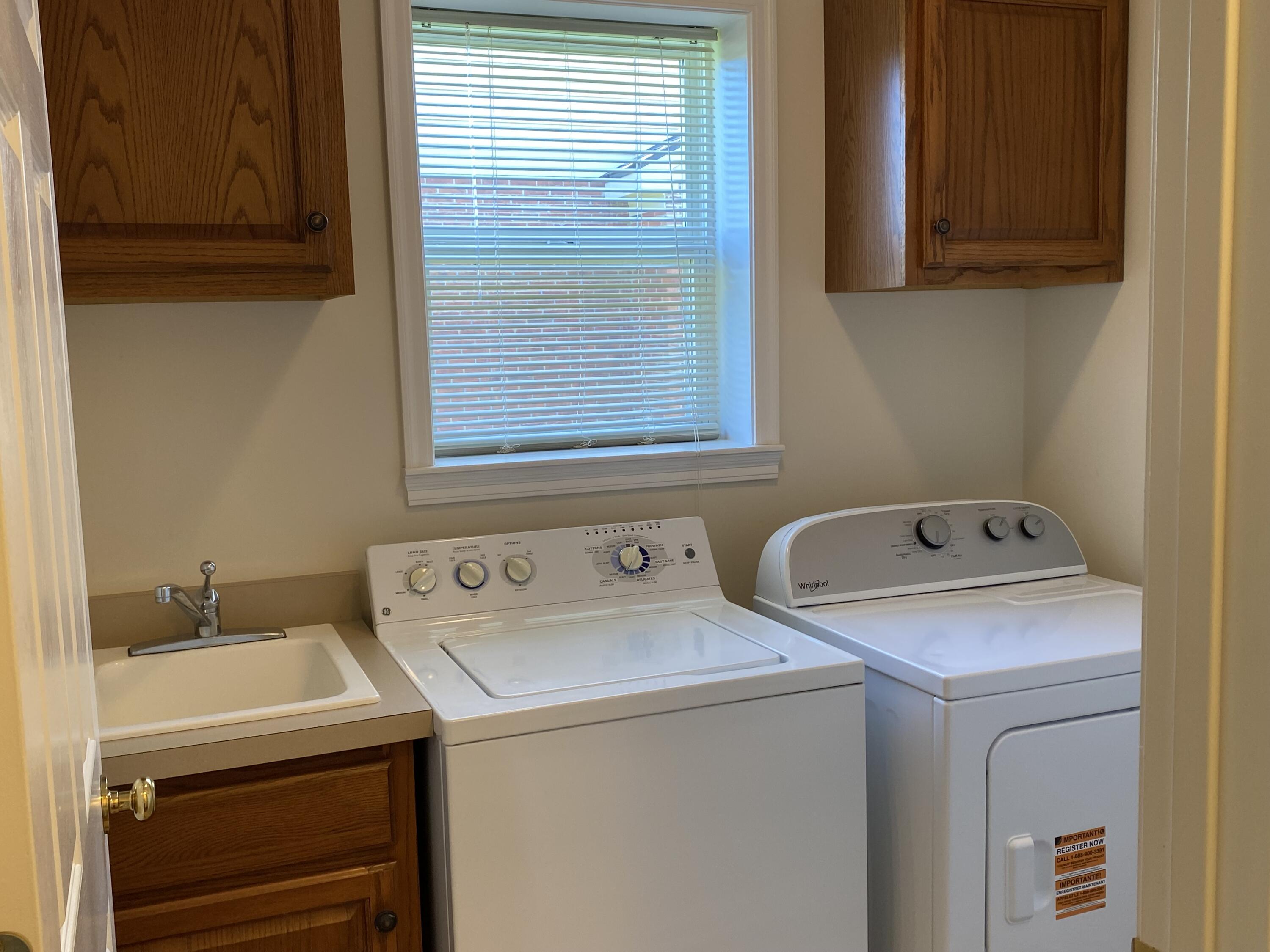 8964 Richmond Road Union, KY 41091 - Photo 20 of 48 Upgraded laundry room with base and wall cabinets and ceramic tile floors. Dryer was new in 2025.