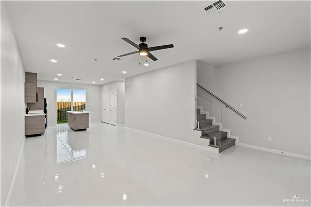 a view of a living room and a ceiling fan