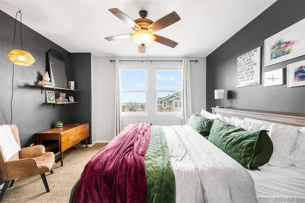 a bedroom with bed and a window