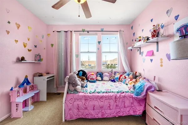 a bed room with a bed and a window