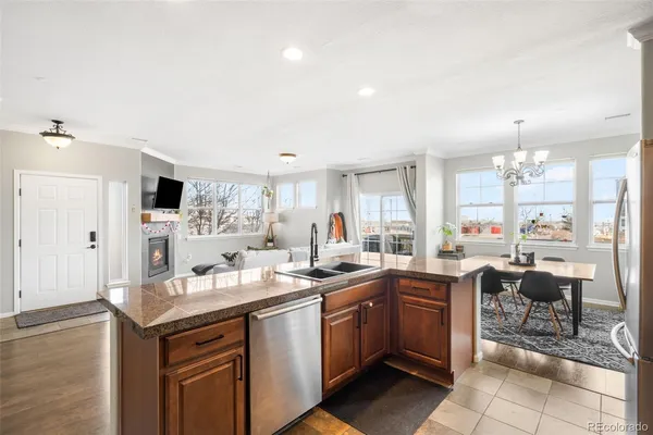 a kitchen with a sink counter top space appliances and cabinets