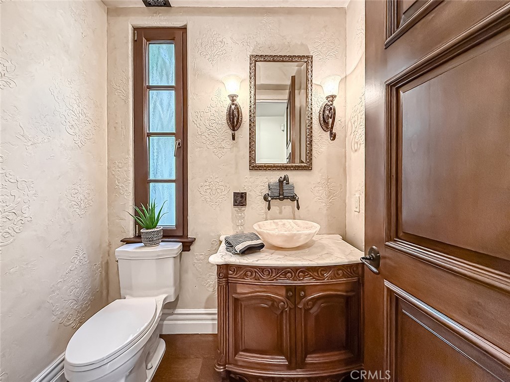 3826 Bowsprit Circle Westlake Village, CA 91361 - Photo 20 of 72 a bathroom with a granite countertop toilet sink and mirror