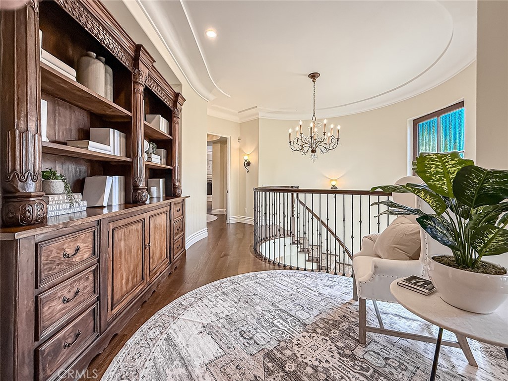 3826 Bowsprit Circle Westlake Village, CA 91361 - Photo 25 of 72 a view of a hallway to dining room and hall with wooden floor