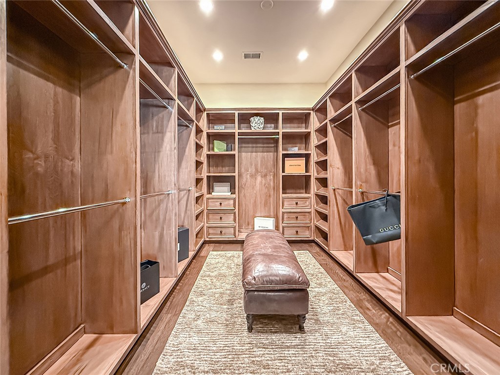 3826 Bowsprit Circle Westlake Village, CA 91361 - Photo 33 of 72 a view of walk in closet with clothes and shoes
